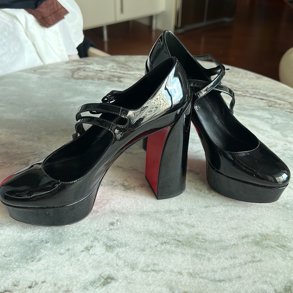 CHRISTIAN LOUBOUTIN
Movida Mary Jane Red Sole Platform Pumps